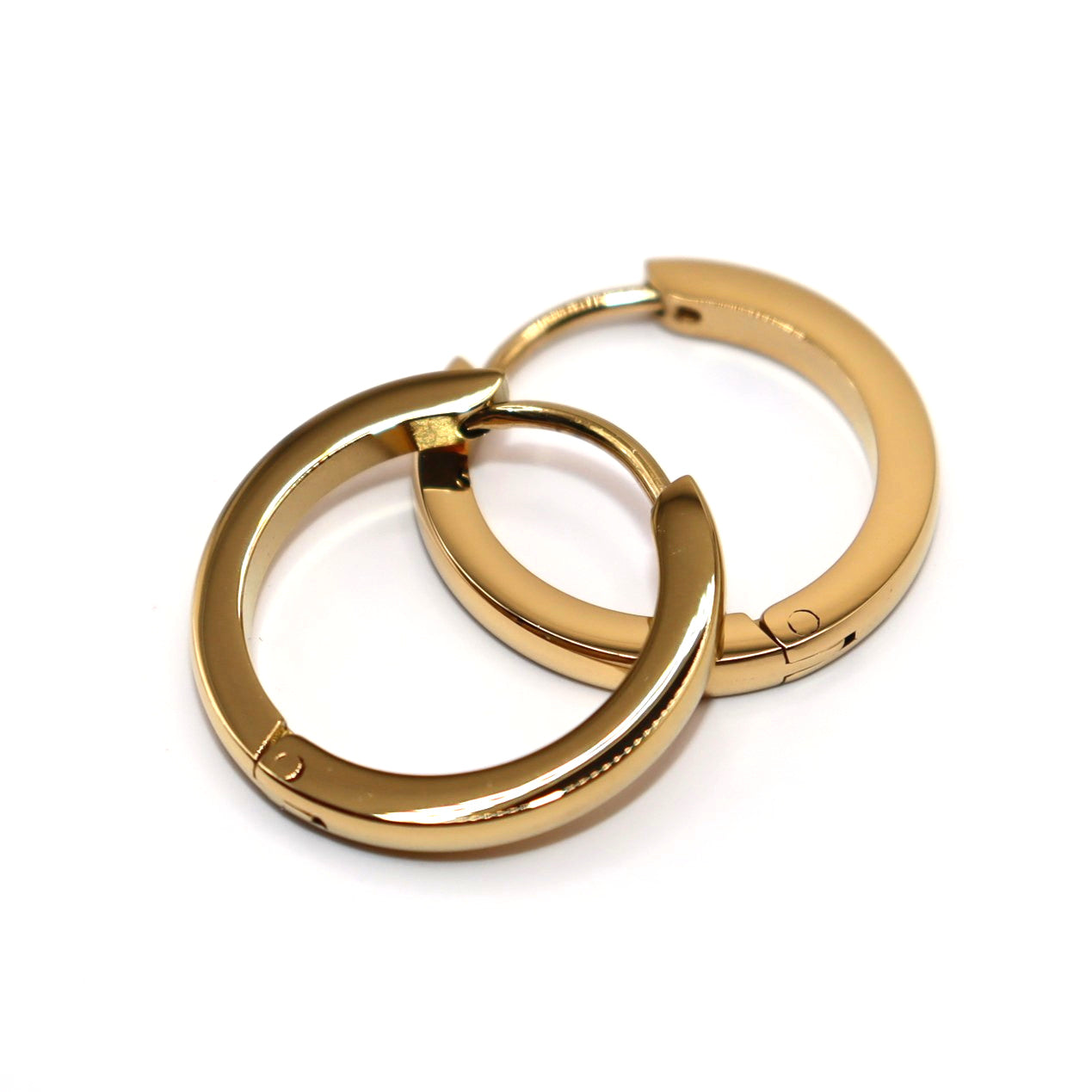 Pair of gold hoop earrings on a white background