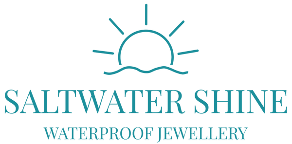 Saltwater shine logo. Teal font with a sun rising from the ocean