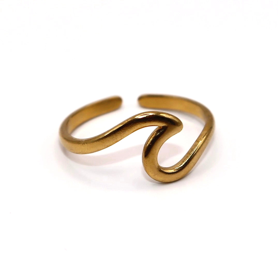 Gold open wave shaped ring on a white background